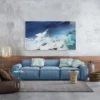 Gemälde "Thalassa" an Sichtbetonwand über blauem Sofa in Wohnzimmer im Industrial-Stil mit Holzverkleidung